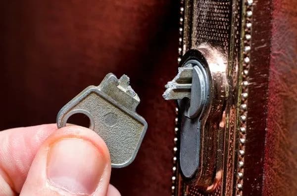 Broken key stuck in a door lock as a warning sign of lock failure